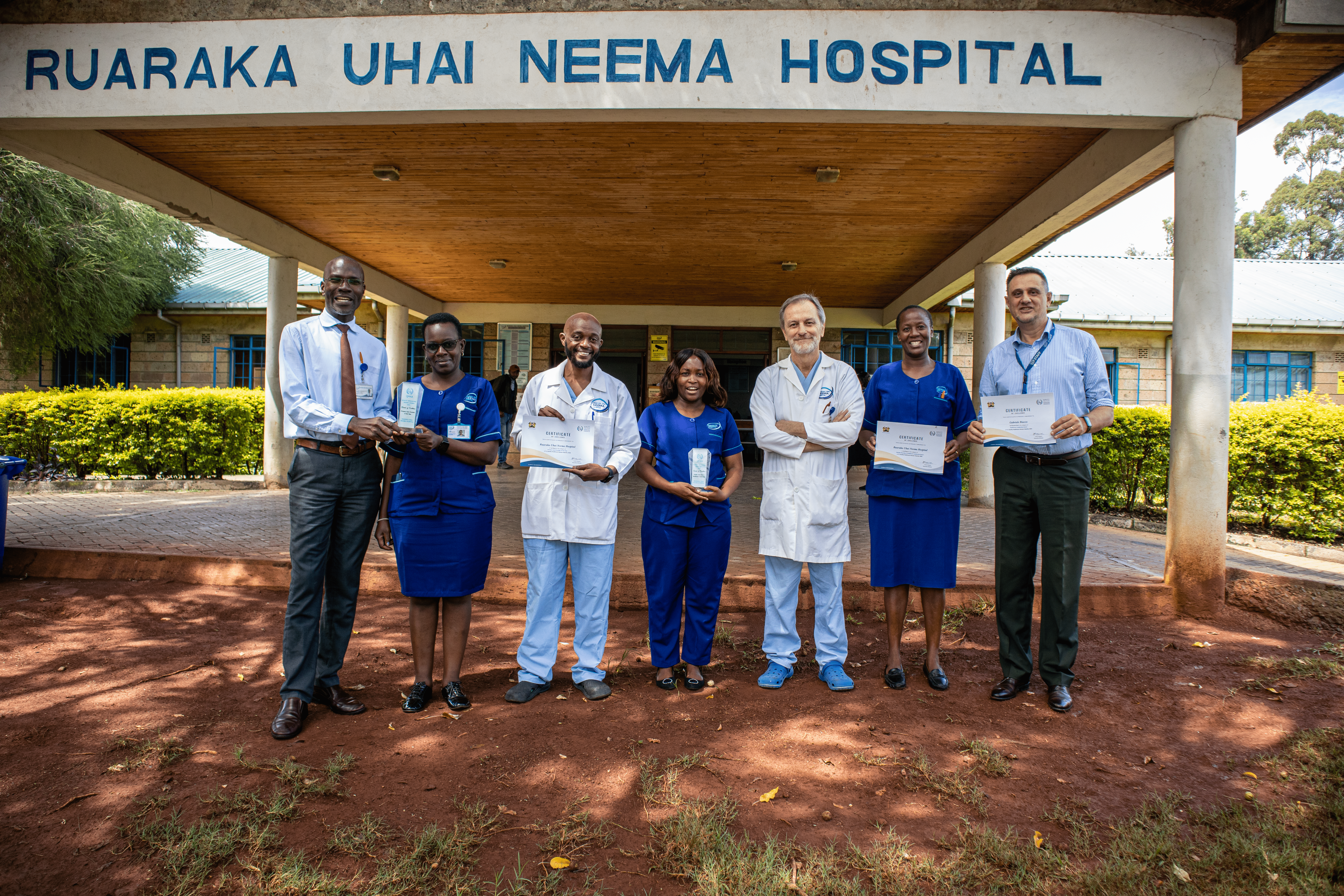 RU Neema Hospital staff in front of hospital